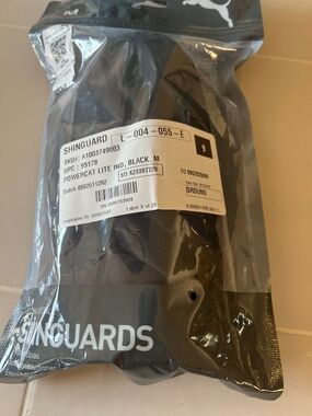 Football / soccer shin guards. New in bag. Medium